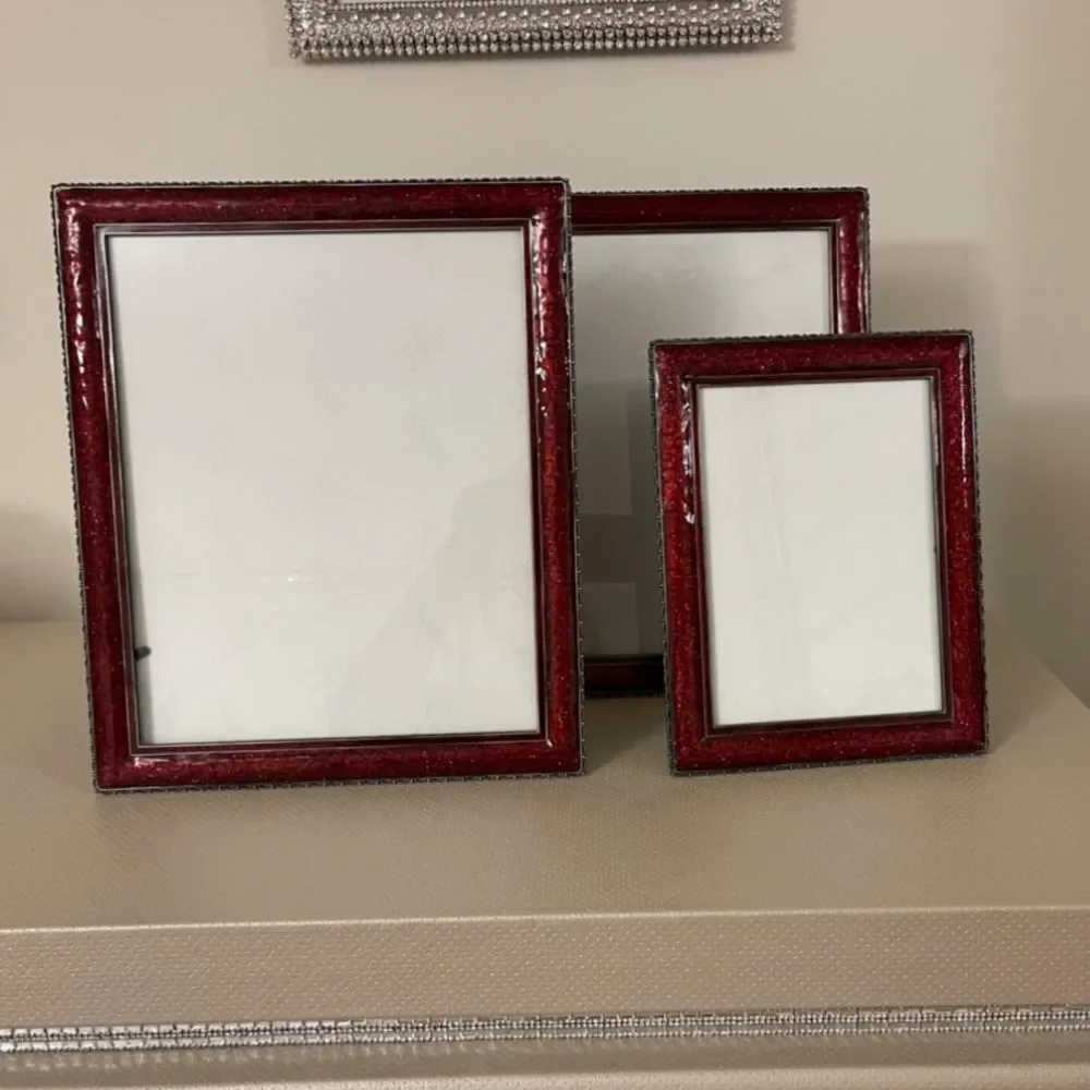 Three burgundy frames